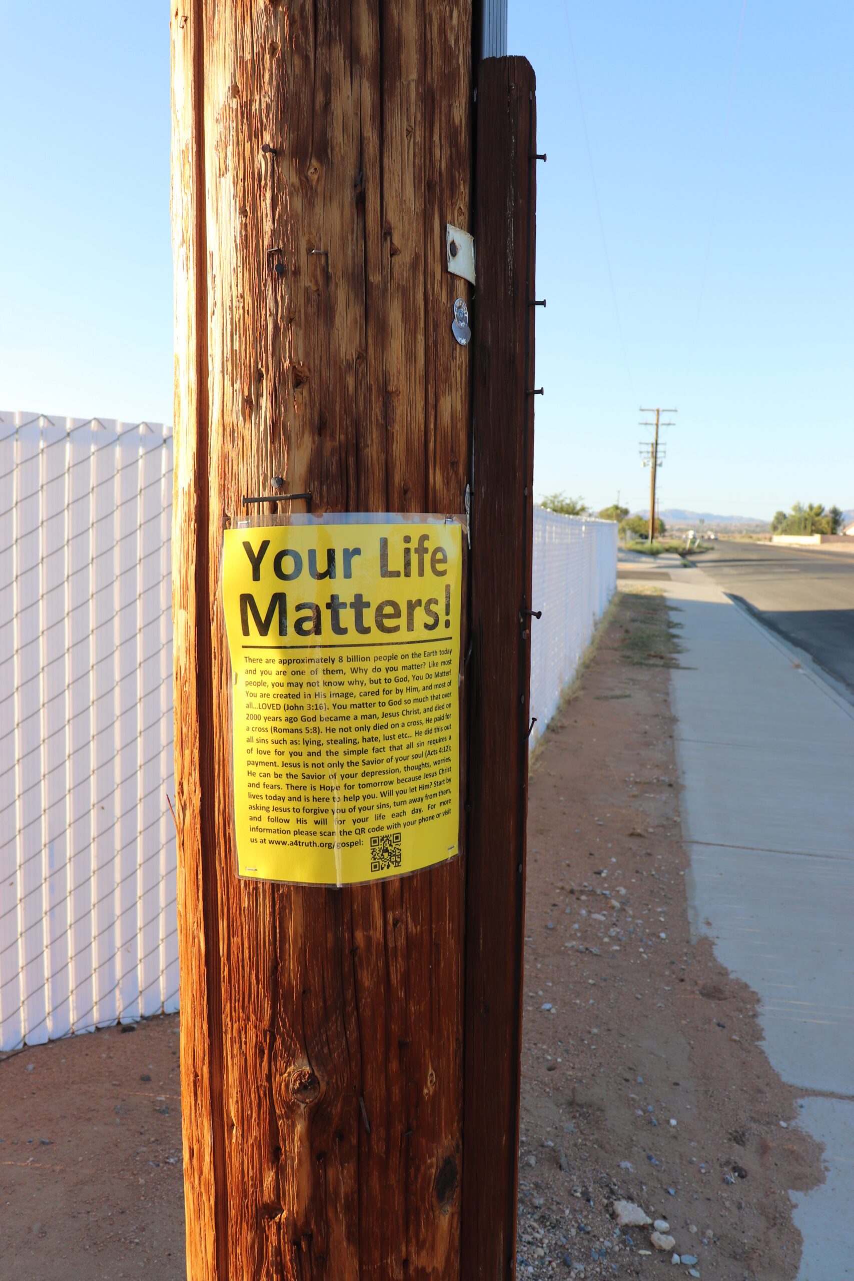 Evangelism Street Sign on Telephone Pole